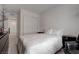 This bedroom features a closet, neutral carpeting, and minimalist decor at 6148 Juniper Grove St, Las Vegas, NV 89148