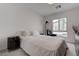 Bright bedroom features a modern design, with white walls and neutral carpeting at 6148 Juniper Grove St, Las Vegas, NV 89148