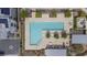 Overhead view of a sparkling pool with lounge chairs and well-maintained landscaping at 6148 Juniper Grove St, Las Vegas, NV 89148