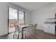 Stylish dining area next to outdoor patio featuring a modern table and chairs at 6148 Juniper Grove St, Las Vegas, NV 89148