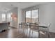 Bright dining area with a modern table, chairs, and large windows at 6148 Juniper Grove St, Las Vegas, NV 89148