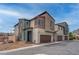 Modern two-story home with a neutral color palette and a two-car garage on a sunny day at 6148 Juniper Grove St, Las Vegas, NV 89148