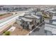 Modern townhome exterior with gray and brown accents, a private yard, and desert landscaping at 6148 Juniper Grove St, Las Vegas, NV 89148