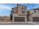 Contemporary two-story home featuring a two-car garage and modern architectural design at 6148 Juniper Grove St, Las Vegas, NV 89148