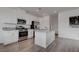 Modern kitchen with stainless steel appliances, white cabinets, and granite countertops at 6148 Juniper Grove St, Las Vegas, NV 89148