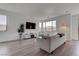 Inviting living room with natural light, sleek furniture, and an open, airy feel at 6148 Juniper Grove St, Las Vegas, NV 89148