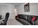 Office with sleek desk and couch, suitable for a comfortable work environment at 6148 Juniper Grove St, Las Vegas, NV 89148
