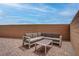 Cozy patio features brick pavers, a brick wall, and comfortable outdoor seating with a coffee table at 6148 Juniper Grove St, Las Vegas, NV 89148