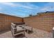 Outdoor patio with modern gray furniture, perfect for relaxation and entertaining guests at 6148 Juniper Grove St, Las Vegas, NV 89148