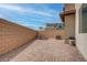 Private patio with brick flooring, outdoor seating, and a secluded ambiance at 6148 Juniper Grove St, Las Vegas, NV 89148