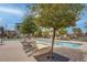 Community pool featuring lounge chairs for residents to enjoy relaxing by the poolside at 6148 Juniper Grove St, Las Vegas, NV 89148