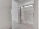 Bright, modern shower with glass door, white tile surround, and grab bar detail at 6148 Juniper Grove St, Las Vegas, NV 89148