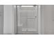 Modern walk-in shower features a glass enclosure, white tiles, and a built-in bench at 6148 Juniper Grove St, Las Vegas, NV 89148