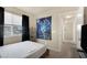 Bedroom with a bed, window, and unique tapestry at 6217 Lapilli Ave, Las Vegas, NV 89139