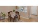 Cozy dining area with light wood floors and a view into the kitchen at 6217 Lapilli Ave, Las Vegas, NV 89139