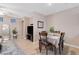 Bright dining area with hardwood floors, a table set for four, and modern decor at 6217 Lapilli Ave, Las Vegas, NV 89139