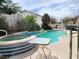 Inviting backyard featuring a swimming pool, spa, and lush landscaping for a perfect outdoor retreat at 6435 Heatherton Ave, Las Vegas, NV 89110