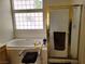 Bathroom featuring a soaking tub, separate shower, and glass block window for natural light at 6435 Heatherton Ave, Las Vegas, NV 89110