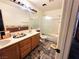 Bathroom featuring dual sinks and a shower with glass doors at 6435 Heatherton Ave, Las Vegas, NV 89110