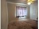 Empty bedroom featuring a window and neutral carpeting at 6435 Heatherton Ave, Las Vegas, NV 89110