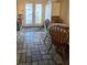 Dining area features tiled floors, a dining table, and access to the backyard at 6435 Heatherton Ave, Las Vegas, NV 89110