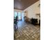 Dining area features tiled floors, a dining table, and access to the backyard at 6435 Heatherton Ave, Las Vegas, NV 89110