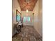 Inviting entryway featuring tiled floors, a decorative mirror, and a stylish light fixture at 6435 Heatherton Ave, Las Vegas, NV 89110