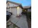Charming home with a well-lit exterior, two car garage, and desert landscaping at 6435 Heatherton Ave, Las Vegas, NV 89110