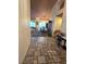 Inviting foyer with tile flooring leading to the living and dining areas, offering a warm ambiance at 6435 Heatherton Ave, Las Vegas, NV 89110