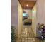 Hallway leading into living room with fireplace and furniture at 6435 Heatherton Ave, Las Vegas, NV 89110