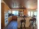 Kitchen area with barstool seating at the breakfast bar, wooden cabinets, and stainless appliances at 6435 Heatherton Ave, Las Vegas, NV 89110