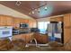Well-lit kitchen features granite counters, stainless steel appliances, and tiled flooring at 6435 Heatherton Ave, Las Vegas, NV 89110