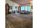 Living room with carpet floors and built-in bookshelves at 6435 Heatherton Ave, Las Vegas, NV 89110