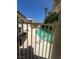Gated pool area view showcases secure access and a refreshing pool, complemented by a serene landscape at 6435 Heatherton Ave, Las Vegas, NV 89110
