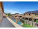 Balcony view of backyard pools and homes at 6442 American Eagle Ave, Las Vegas, NV 89131