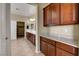 Bathroom featuring beautiful cabinetry, dual sinks, granite countertops, and a separate door to the closet at 6442 American Eagle Ave, Las Vegas, NV 89131