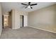 A spacious bedroom featuring carpet flooring, neutral walls, and closet with white doors at 6442 American Eagle Ave, Las Vegas, NV 89131