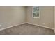 Neutral bedroom with carpet floors, one window and base trim at 6442 American Eagle Ave, Las Vegas, NV 89131