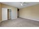 Bedroom showcasing plush carpet, a ceiling fan, and a closet at 6442 American Eagle Ave, Las Vegas, NV 89131
