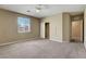 Bedroom featuring plush carpet, a ceiling fan, a closet, and natural light at 6442 American Eagle Ave, Las Vegas, NV 89131