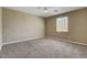 Spacious bedroom features neutral walls, soft carpet, and a ceiling fan at 6442 American Eagle Ave, Las Vegas, NV 89131