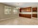 Bright dining room featuring tile flooring, ample natural light, and built-in cabinetry for storage at 6442 American Eagle Ave, Las Vegas, NV 89131