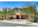 Attractive two-story house with lush landscaping and a spacious driveway at 6442 American Eagle Ave, Las Vegas, NV 89131