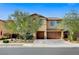 Charming two-story home with a well-manicured lawn and mature trees at 6442 American Eagle Ave, Las Vegas, NV 89131