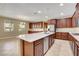 Spacious kitchen with granite counters, stainless appliances, and dark cabinets at 6442 American Eagle Ave, Las Vegas, NV 89131