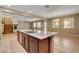 Island kitchen area with granite counters, seating, and stainless dishwasher at 6442 American Eagle Ave, Las Vegas, NV 89131