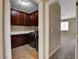 Featuring modern front load washer and dryer with tile floors and cabinetry at 6442 American Eagle Ave, Las Vegas, NV 89131