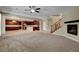 Open layout living room flows into kitchen with dark wood cabinets at 6442 American Eagle Ave, Las Vegas, NV 89131