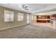 Open layout living room is adjacent to kitchen with stainless appliances at 6442 American Eagle Ave, Las Vegas, NV 89131