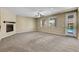Spacious living room with fireplace, ceiling fan, and access to pool area at 6442 American Eagle Ave, Las Vegas, NV 89131